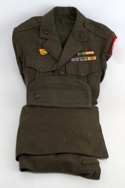 WWII 1944 DATED 6TH MARINE DIV RAIDER USMC UNIFORM: Tunic overseas cap and trousers dress green wool, with dated 1944/45 inner arm sleeve, red felt 1st assault raider patch and ribbons with collar and hat EGA insignia, first SGT. cloth sleeve insignia.