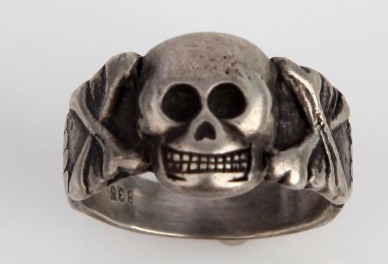 PANZER DIVISION RING WITH SKULL AND CROSS BONES: Ring is stamped 835 inside and has light scratches on and around the skull. Ring is silver and has an enamel top. This lot has a reserve.