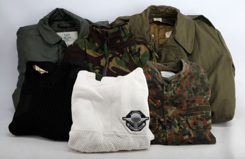 USABLE LARGE SIZE MILITARY UNIFORM LOT MOVIE PROPS: High quality to specification and some government issue gear as well includes, U.S. Camo coat 42/44, long extra large heavy olive drab over coat, German sleeveless camo vest, 42/44 aviator Air Force j