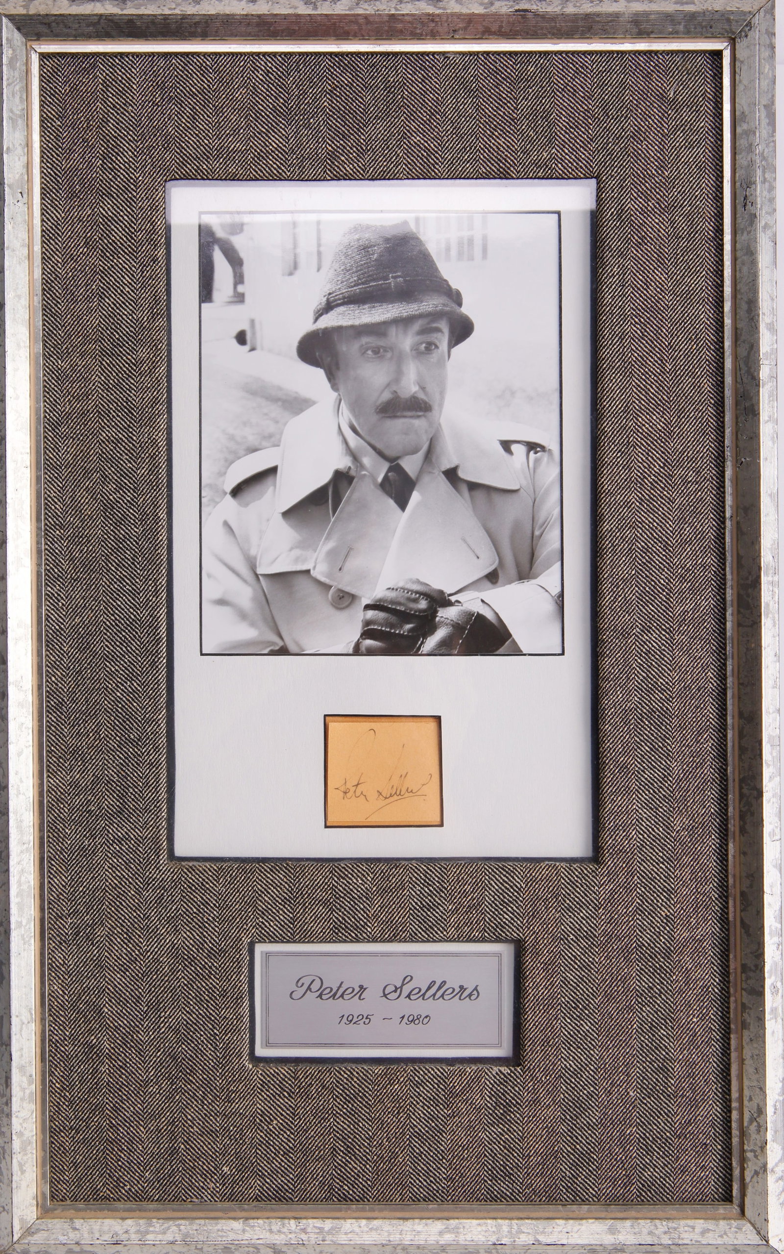 Peter Sellers Framed Autograph Inspector Clouseau: A framed autograph from renowned British actor and comedian Peter Sellers, accompanied by a photo of him in his iconic Inspector Clouseau costume. This autograph has been compared to known historic ex