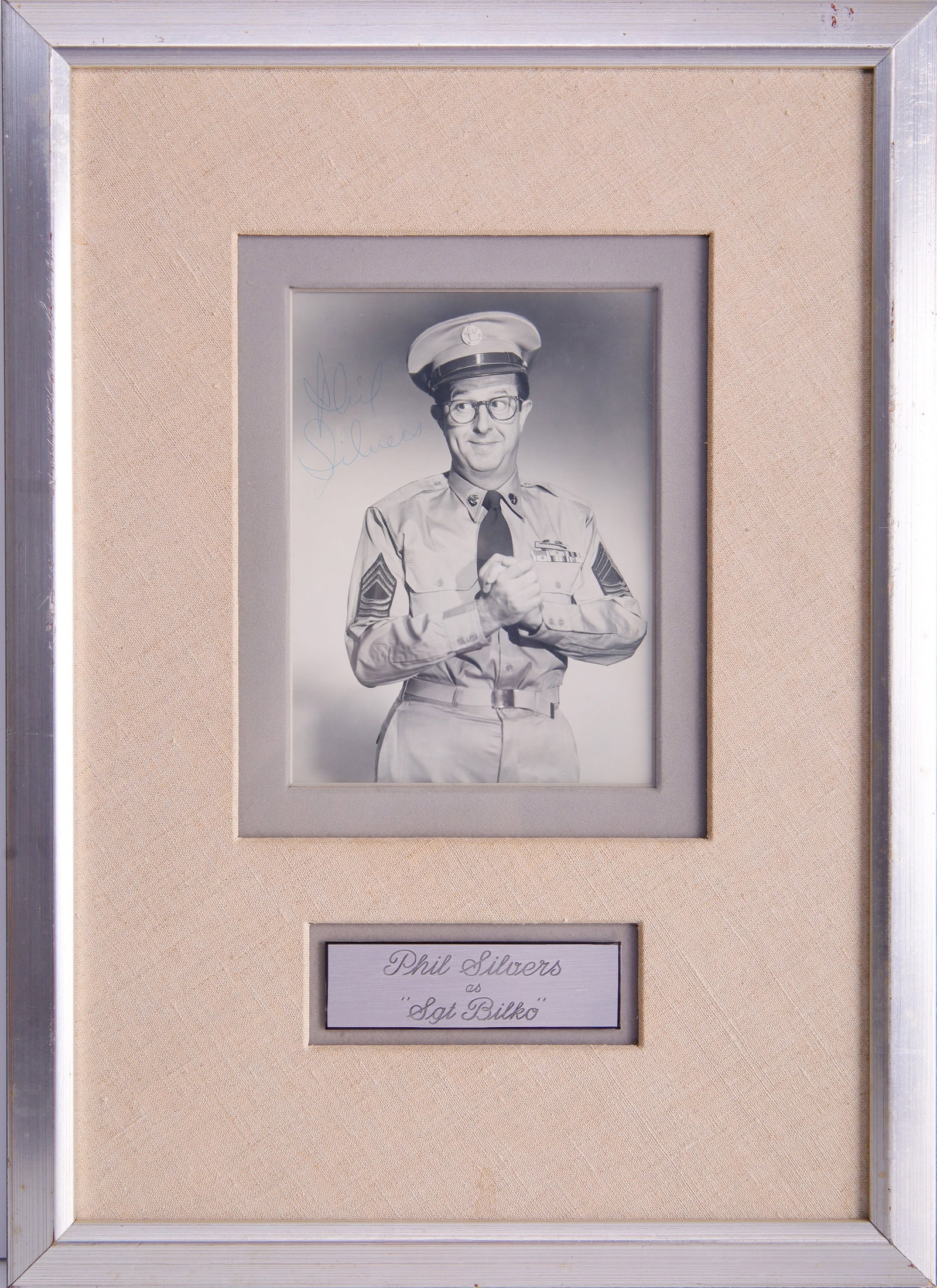 Phil Silvers Framed Autograph as Sgt. Bilko: A framed autograph of comedian Phil Silvers, in his costume as Sgt. Bilko from the Phil Silvers Show. This autograph has been compared to known historic examples and has been deemed authentic accordin