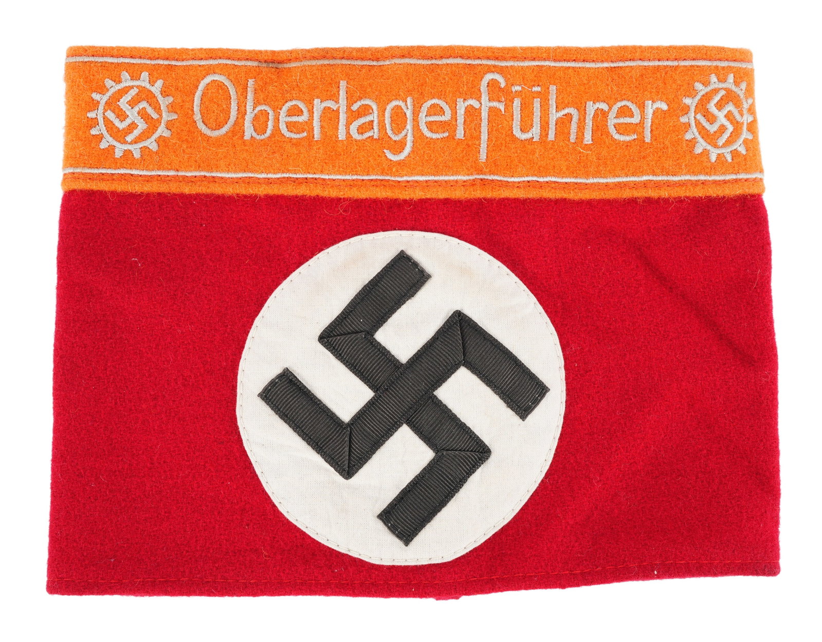 DAF Senior Camp Leader Armband WWII German: DAF Senior Camp Leader armband. Red wool with separate roundel. Orange cloth at top with DAF insignia and Oberlagerfuhrer embroidered. Non-fluorescing. It measures 8x6 inches. | This lot has a reserve