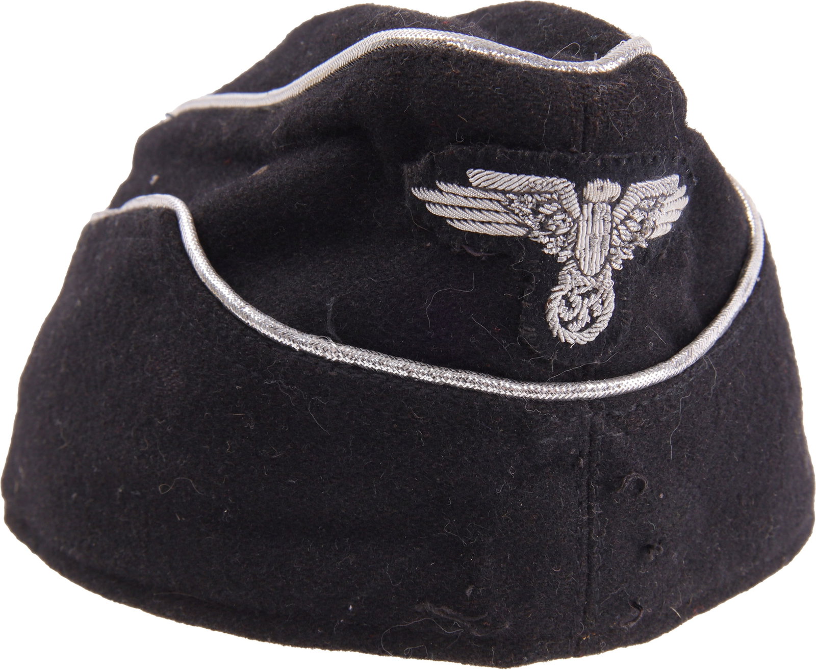 SS Overseas Cap for NCO WWII German: SS Overseas Cap for NCO WWII German. Black doeskin wool with aluminum bullion piping and embroidered reichsadler. One vent hole per side. It measures 10 3/8 inches. Post war example.