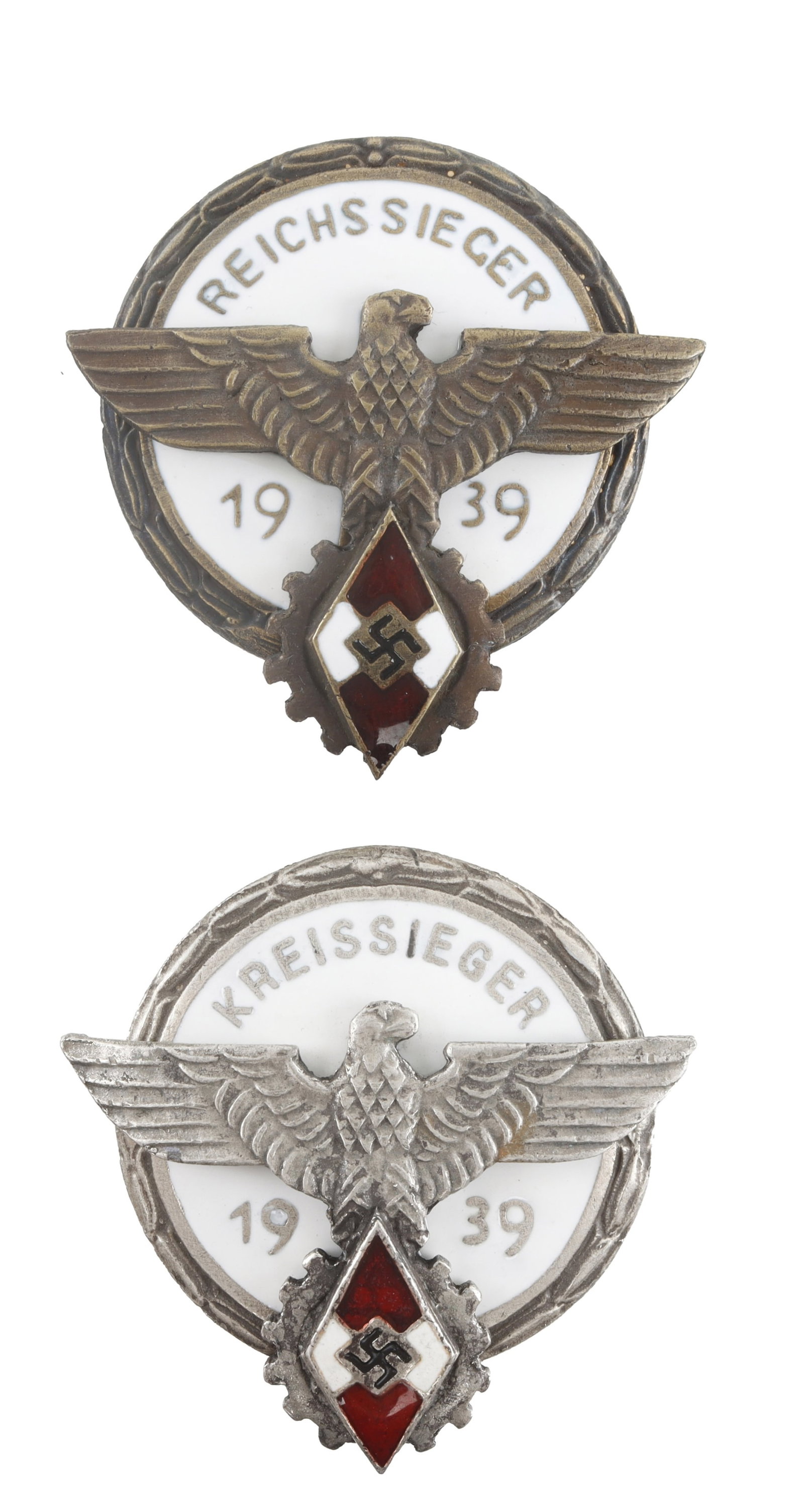 Hitlerjugend Sieger Badges Lot of 2 WWII German: 1) Reichssieger 1939 Hitlerjugend badge. 2) Kreissieger 1939 Hitlerjugend badge. Both badges display a Reichsadler with the diamond swastika of the Hitlerjugend and have an approximate 1.75 inch diame