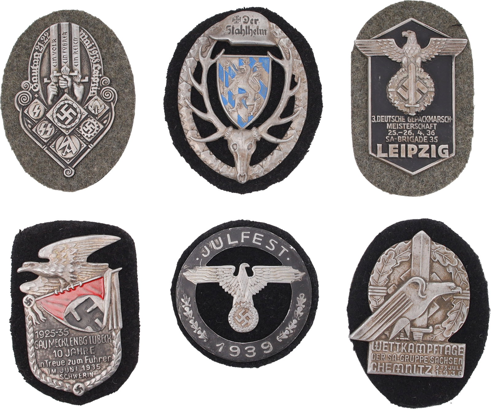 WWII German Military Badges Lot of 10: One Julfest 1939 winter solstice badge. Black felt with gray Julfest 1939 encircling a silver eagle holding swastika in round wreath. Approx one inch in diameter. One Stahlhelm WWI badge for Bavaria, 