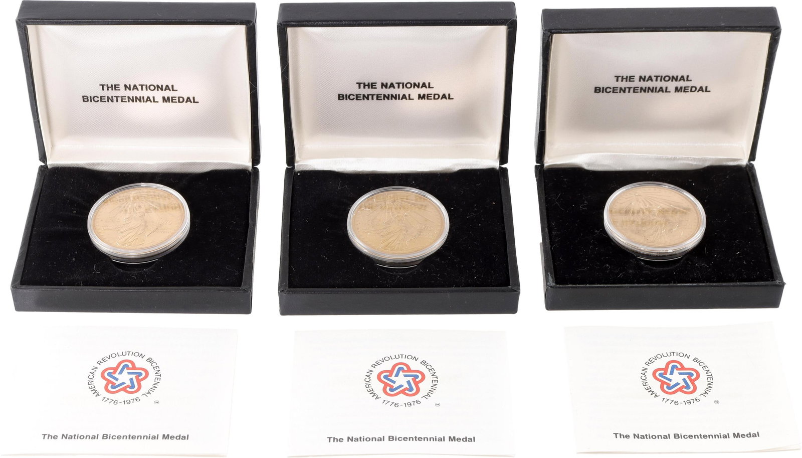 National Bicentennial Medal Gold-Plated Cased 3pcs: Lot of three (3) US National Bicentennial Medals with original cases and papers. Gold-plated bronze, 1.5-inch diameter, with Statue of Liberty obverse and Great Seal of the United States reverse.