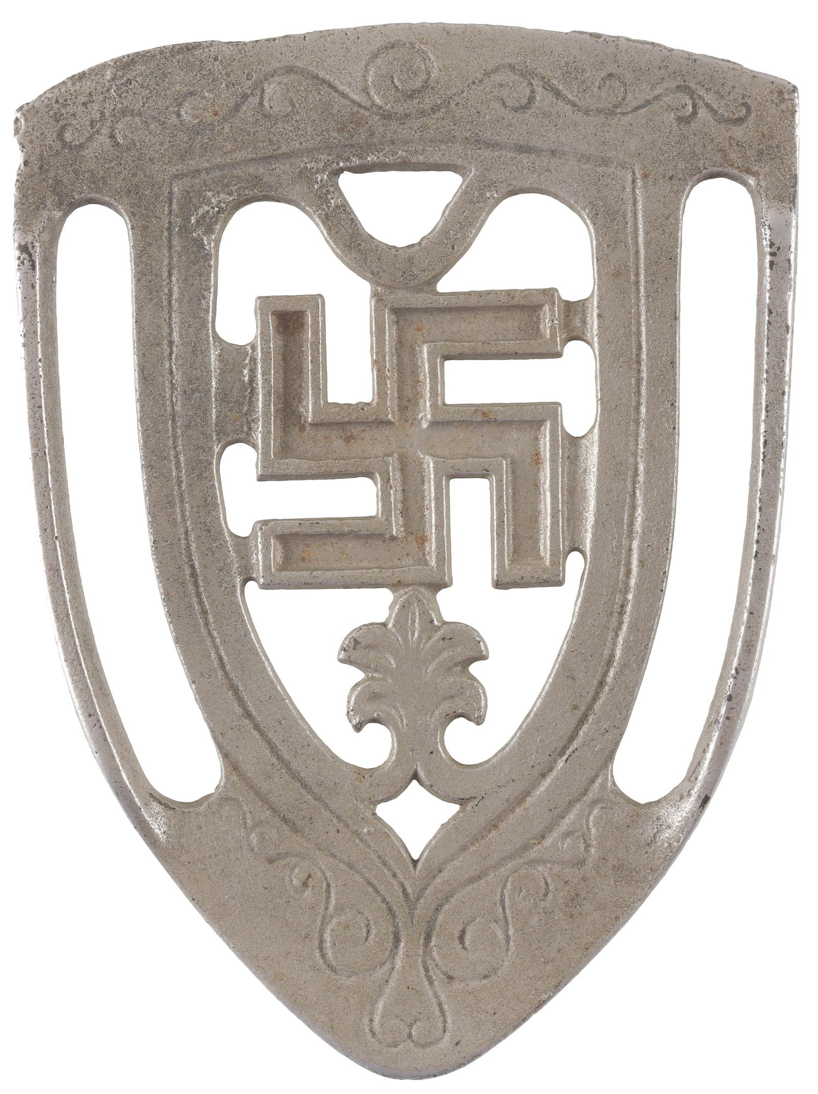 Vintage Good Luck Swastika Trivet Etched Cast Iron: A vintage, three-pronged ironing board trivet with an etched face design. Cast iron construction. Very light oxidation. Measures approximately 5.5" x 4".