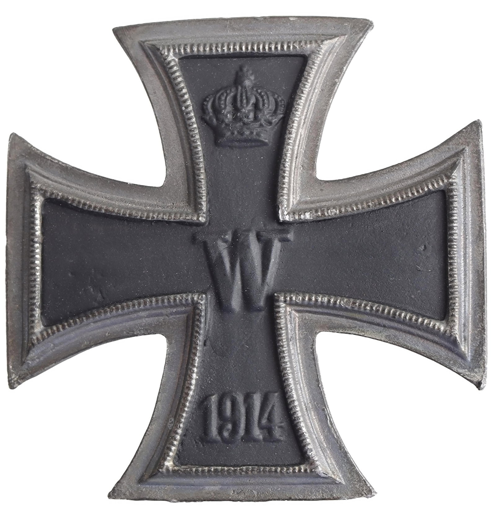 WWI German Imperial Iron Cross First Class 1914: A WWI German iron cross first class. Silver frame with a black iron inlay and a pin-back; inlay features a relief of the crowned cipher of Kaiser Wilhelm II at the center and '1914' below. Measures ap