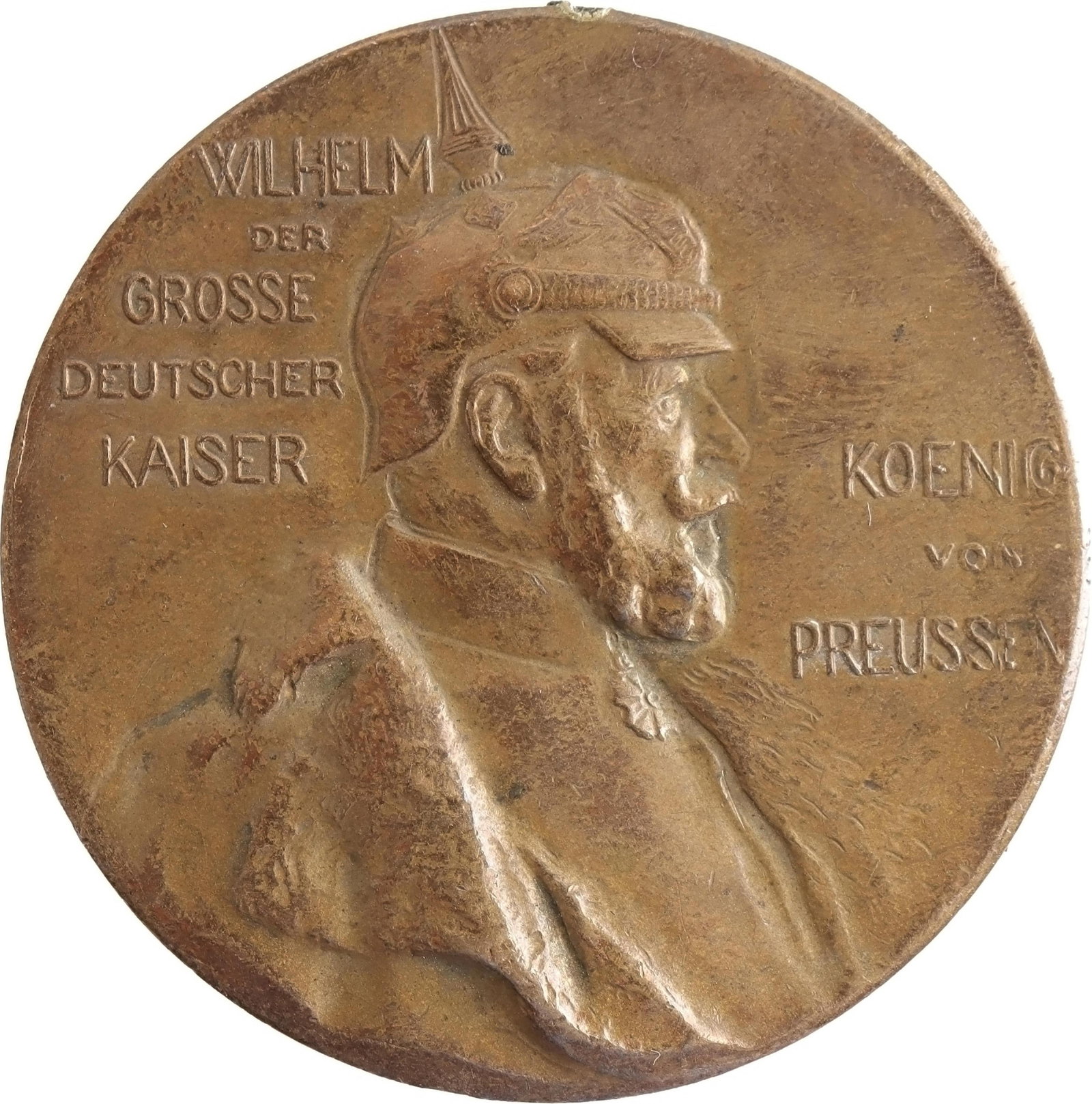 Prussian Centenary Kaiser Wilhelm Military Medal: A bronze medallion issued in 1897 to commemorate Germany's centennial anniversary; mount, suspender, and ribbon missing. The obverse side shows an effigy of Wilhelm I, as well as the inscriptions, "WI
