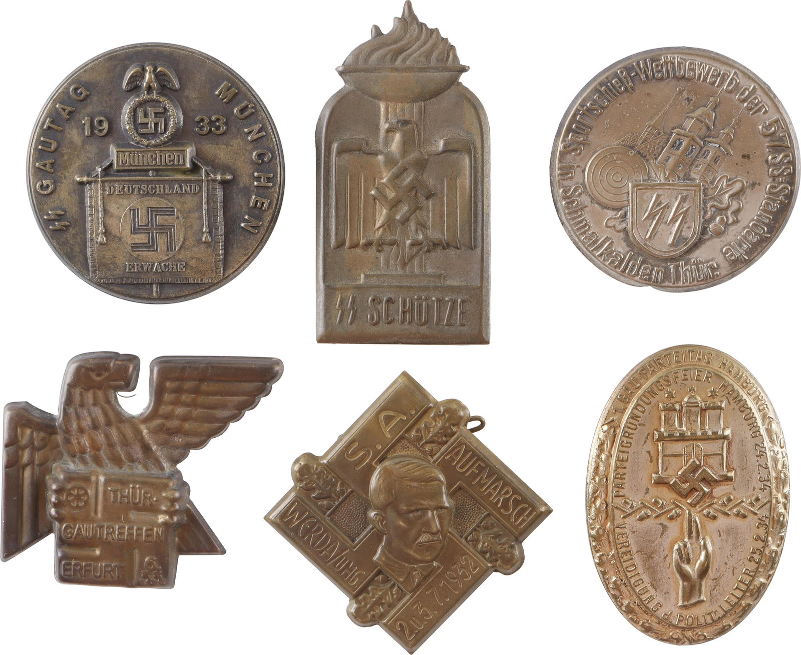 Miscellaneous Tinnies SS Gautag Lot of 6: Variety of Third Reich Tinnies. SS Schutze, SS Gautag 1933, NSDAP Thur. Gautreffen erfurt SA Aufmarsch, Measure 1 1/2 - 2 inches. | This lot has a reserve.