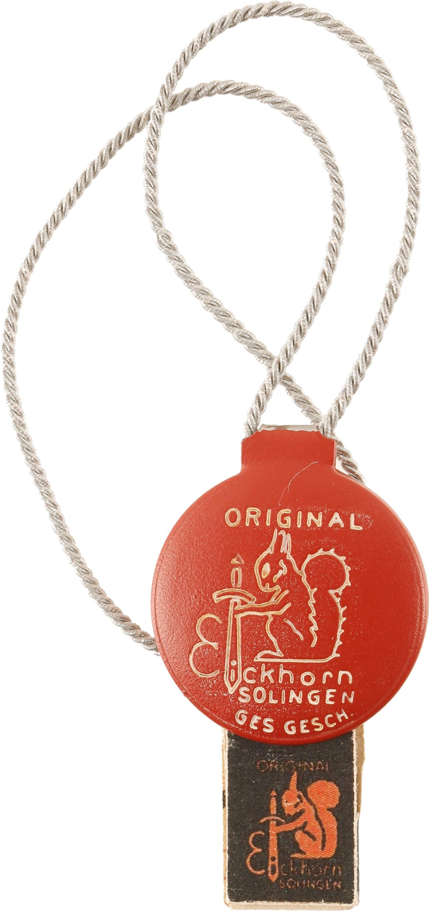 WWII Eickhorn Factory Tag for Daggers & Swords: Red and white painted steel and aluminum bullion cord. Measures 7 1/2 inches in length. The tag itself measures 1 1/4 inches. Comes with the paper guarantee. | This lot has a reserve.
