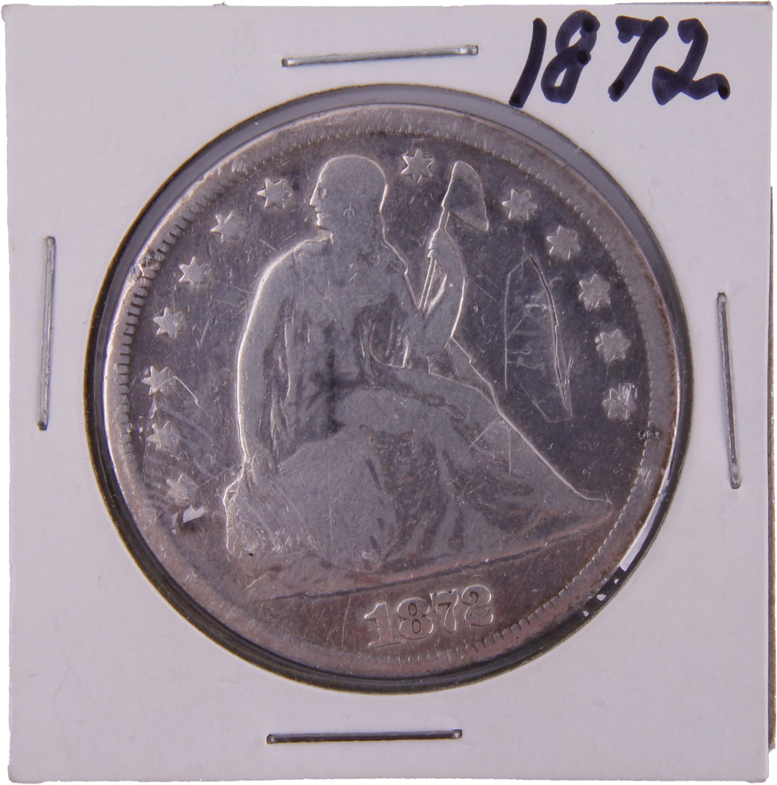 US 1872 Seated Liberty Silver Dollar: United States 1872 Seated Liberty silver dollar. Philadelphia Mint issue (no mintmark). Metal: Silver Country of Origin: US Year Minted: 1872.