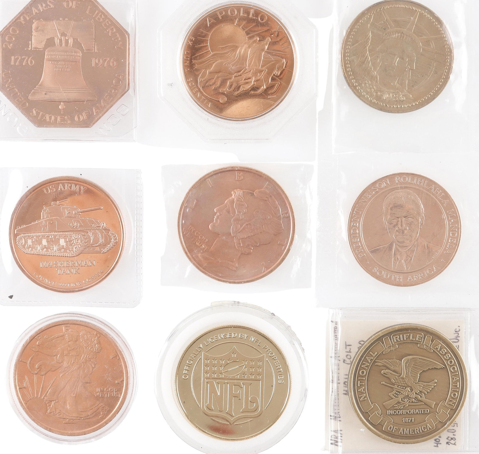 Lot of 9 Commemorative Coins: Nine varied commemorative coins. Copper colored Apollo 13 coin; official mission logo on front , Image of the three astronauts on back. Golden colored NRA Coin commemorating the 80th Anniversary of th