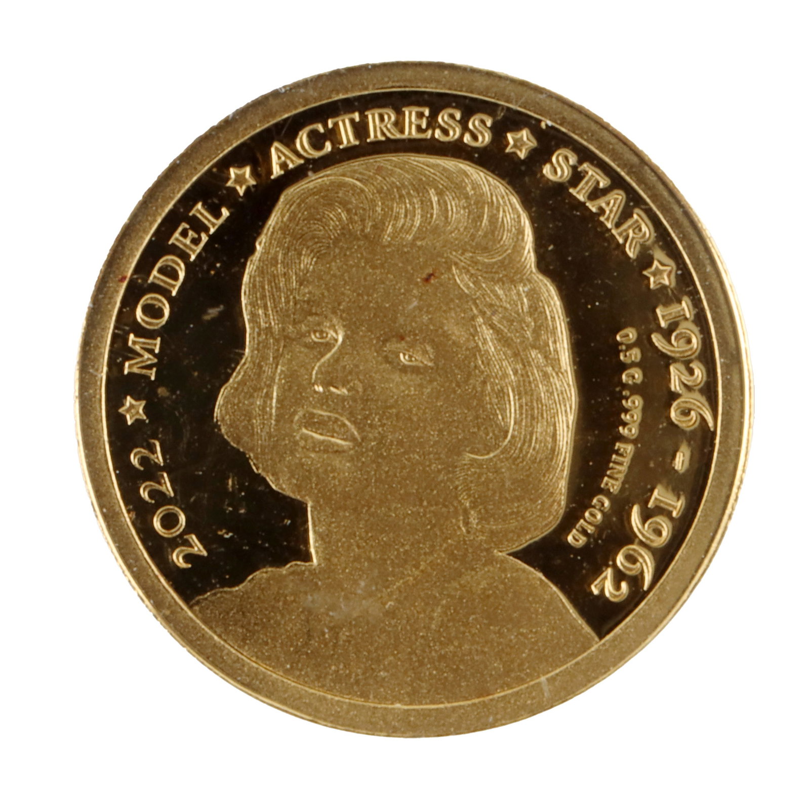 2022 Gold Marilyn Monroe Congolese Mini Coin: A .999 purity gold commemorative mini coin featuring a portrait of Marilyn Monroe on the obverse side and the coat of arms of the Republic of Congo on the reverse side. The mini coin was released to c