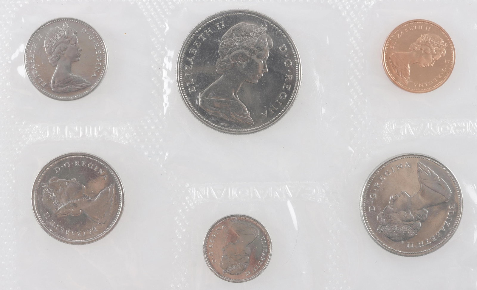 Set of 1969 Canadian Collector Coin set: Six Canadian 1969 coins in unopened cellophane wrapper. Likeness of Elizabeth II on front, Various traditional depictions on back. Canadian seal on half dollar, Elk on quarter, beaver on nickel, maple