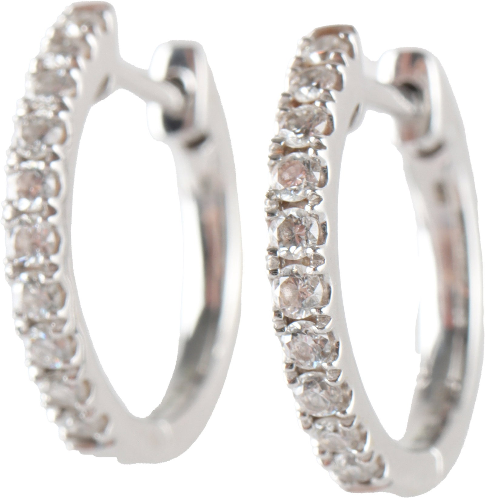 1/10ct Diamond Huggie Hoop Earrings 14K White Gold: Stamped "14K" inside hoop. Measure 12 millimeters in length. Diamonds are I2-I3 in clarity. | This lot has a reserve.