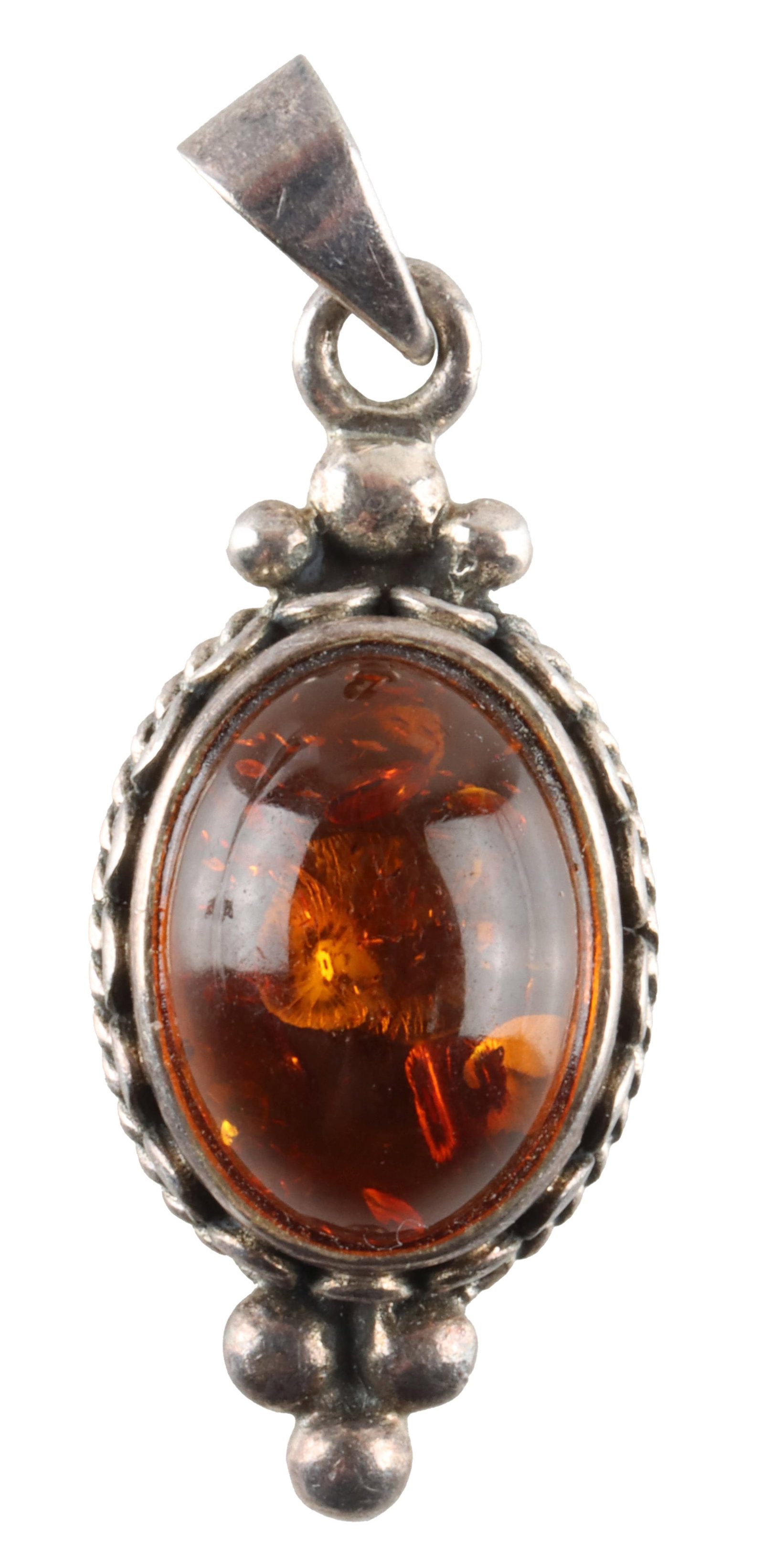 Vintage Sterling Silver Necklace Pendant Amber: A vintage, marked Sterling silver pendant with inlaid Baltic amber. Likely Polish in origin, but lacks a maker's mark. Measures approximately 1" x 1/2"; weighs 4.4 grams. | This lot has a reserve.