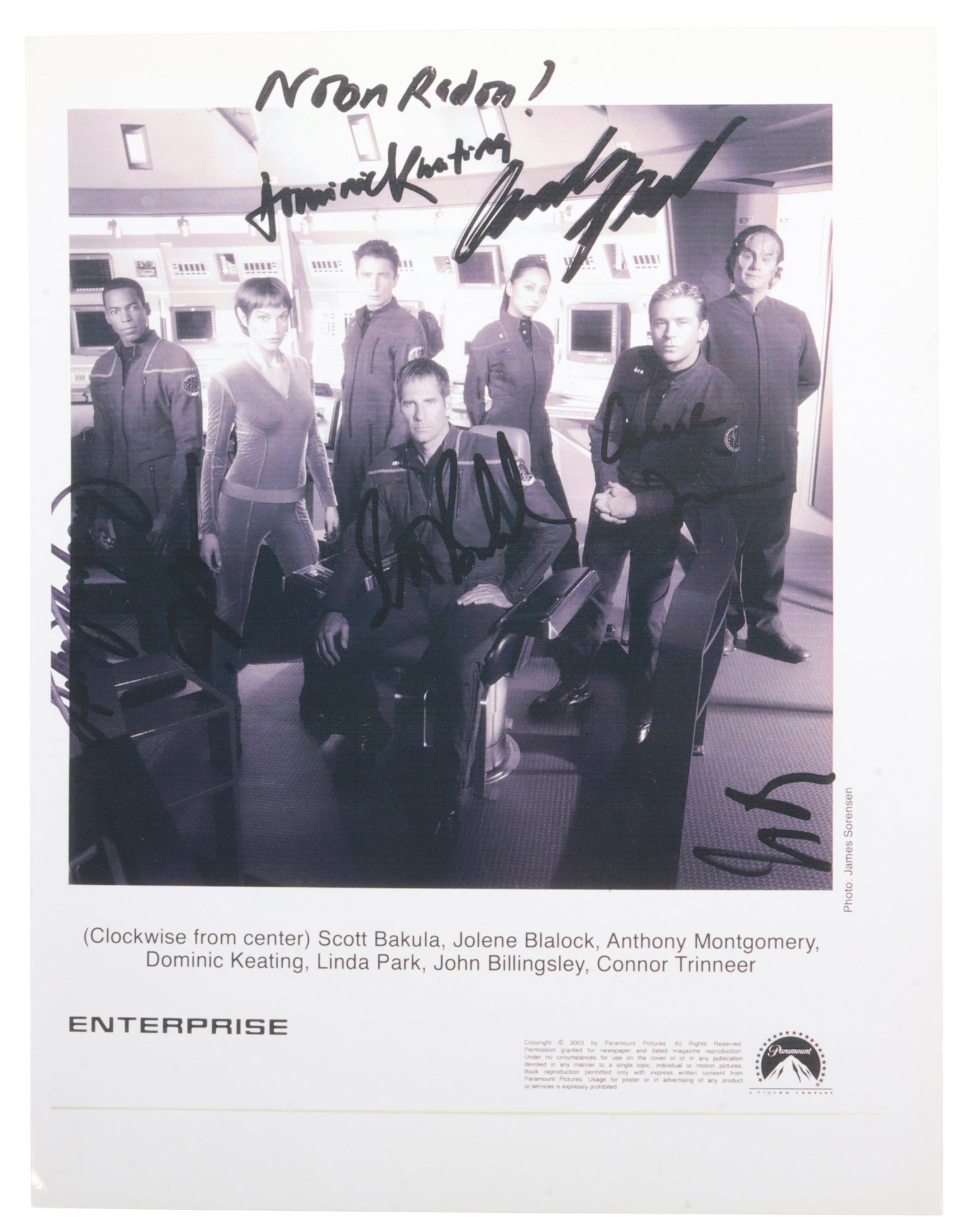 Star Trek Enterprise Signed Cast Photo Bakula: A signed photo from the cast of Star Trek: Enterprise. Includes signatures from Scott Bakula, Dominic Keating, Jolene Blalock, Anthony Montgomery, Linda Park, John Billingsley, and Connor Trinneer. Th