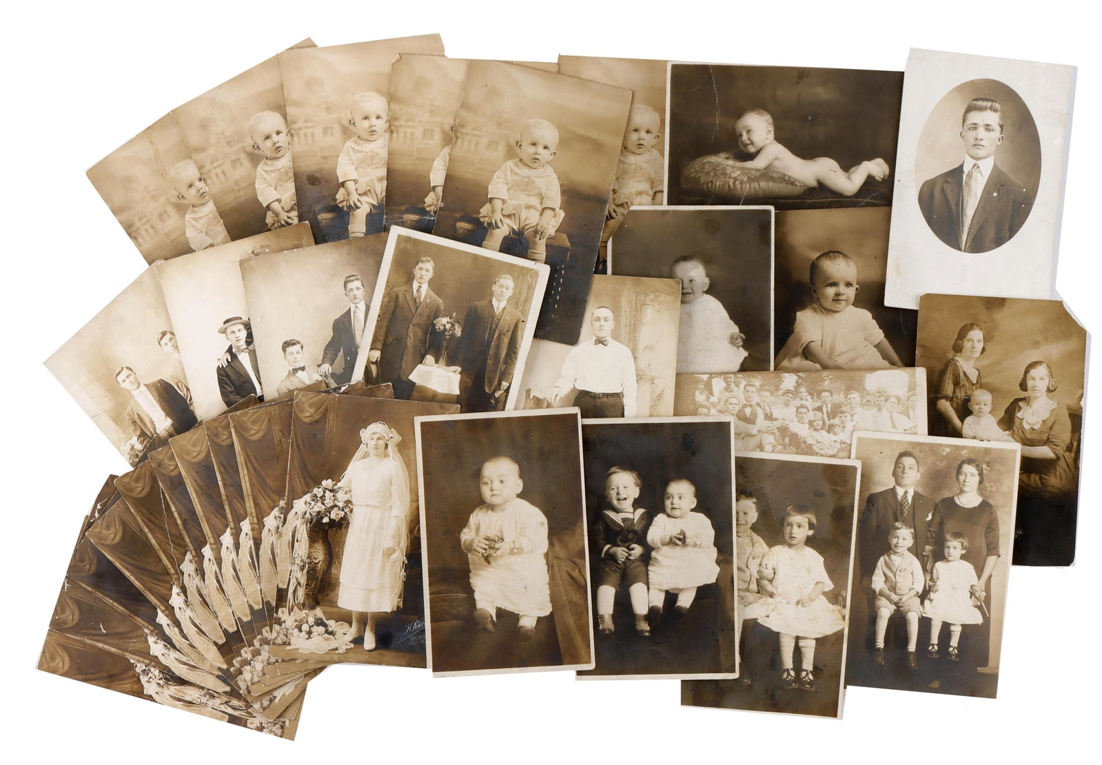 Lot of 30.Vintage Postcards 1910-20. Studio Poses: Thirty vintage postcards from 1910s or 1920s. Most are studio poses of babies, children or two men. Silver Gelatin Prints, type of black and white photos. One with scribbling on the back.