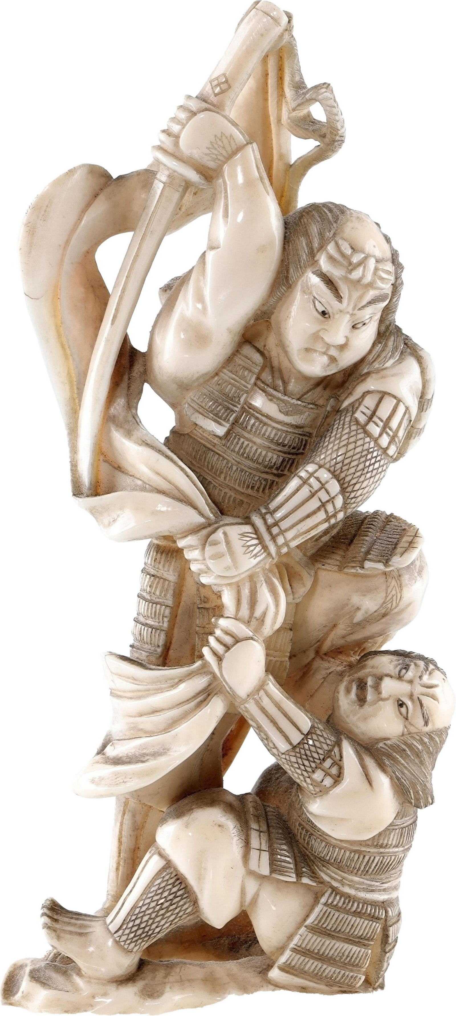 Japanese Ivory Styled Okimono of Two Samurai: Resin statue of a samurai cutting down another samurai. They are both in battle, in gear without helmet. The assumed prevailing man is standing atop the other man's shoulder, ready to cut him down. It