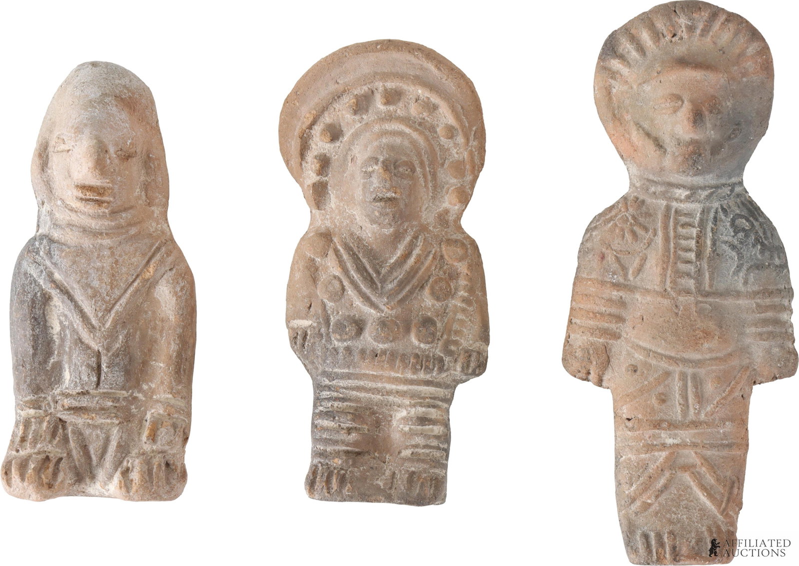 Three South American Style Clay Figurines.: Three South American Style Clay Figurines. The figurines are made of clay and decorated with carved geometric designs. On the reverse sides of the figures there is a tag that says "Radiant Ecuador.".