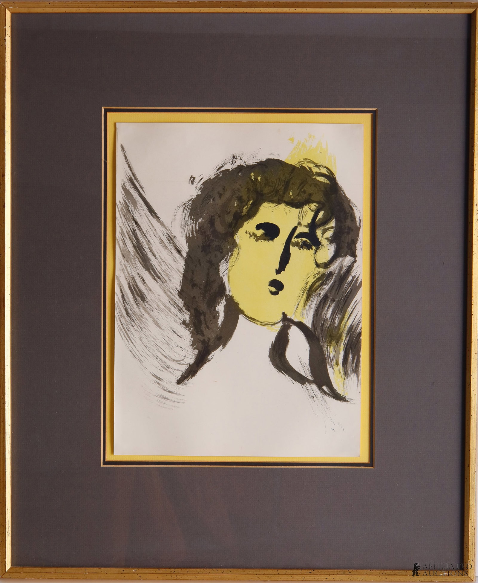 Marc Chagall The Angel Lithographic Print: A lithographic print of Marc Chagall's 'The Angel,' showing a woman with yellowed face with the starts of wings in the background. 10x13.75 inches. Marc Chagall (Russian-French, 1887?1985) was a