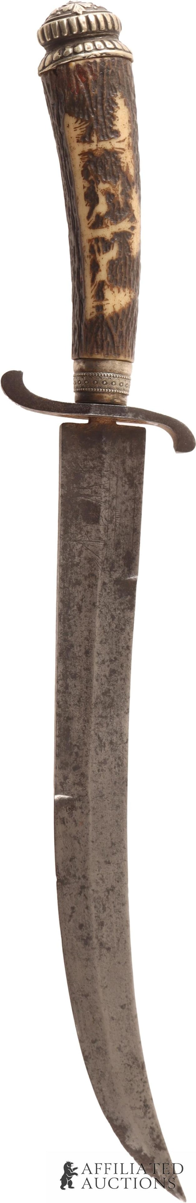 Hunting Bolo Knife 19th-Century: Steel blade with stag grip, nickel silver spacer and pommel, iron cross guard. Blade has hand engraved ship scene while the grip has carved hunting or safari scene. It measures 14 3/4 inches.