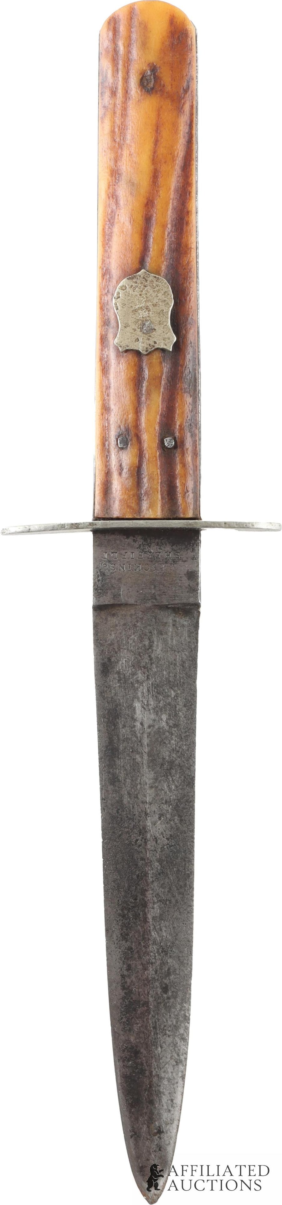 E.M Dickinson Invicta Sheffield Stag Handle Dagger: Antique dagger with steel blade and guard. Two-pin tag handle and features a signature silver badge. Marked E.M Dickinson from Sheffield, England. Blade measures 4.85 inches, handle measures 3.75 inch