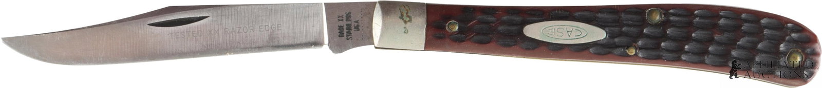 Vintage 1970 Case XX 61048 Slimline Trapper Knife: A vintage Case XX 61048 Slimline Trapper pocket knife with a single clip point blade, which measures approximately 3 1/2" x 1/2". Features a jigged Delrin handle with nickel emblem stamped 'CASE' with