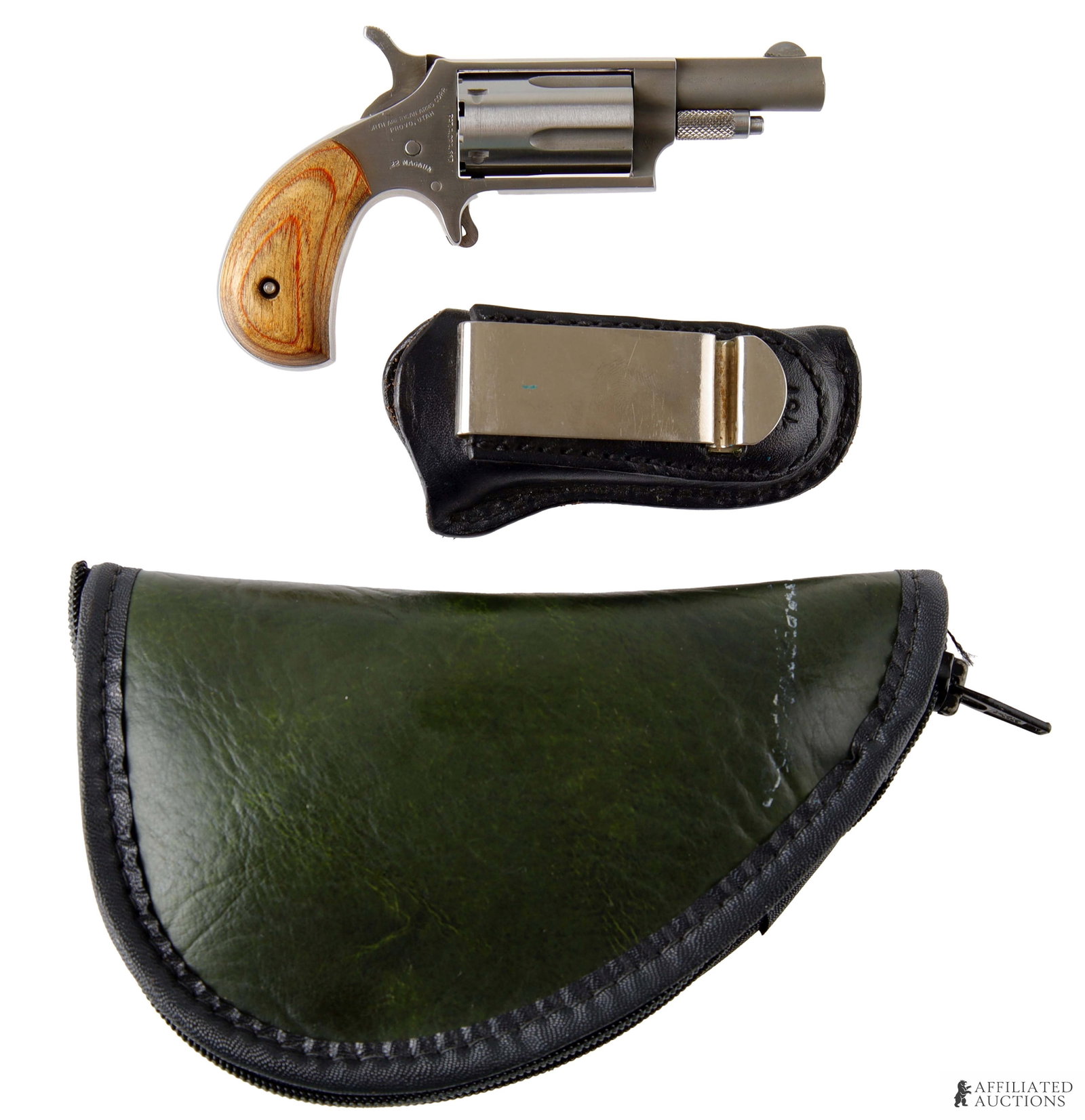 North American Arms .22 Magnum Revolver: North American Arms .22 Magnum single-action spur trigger revolver with leather IWB holster. Barrel length 1-5/8 inches. FFL required for transfer. Caliber: 22 Winchester Magnum (Rimfire) Serial Numbe