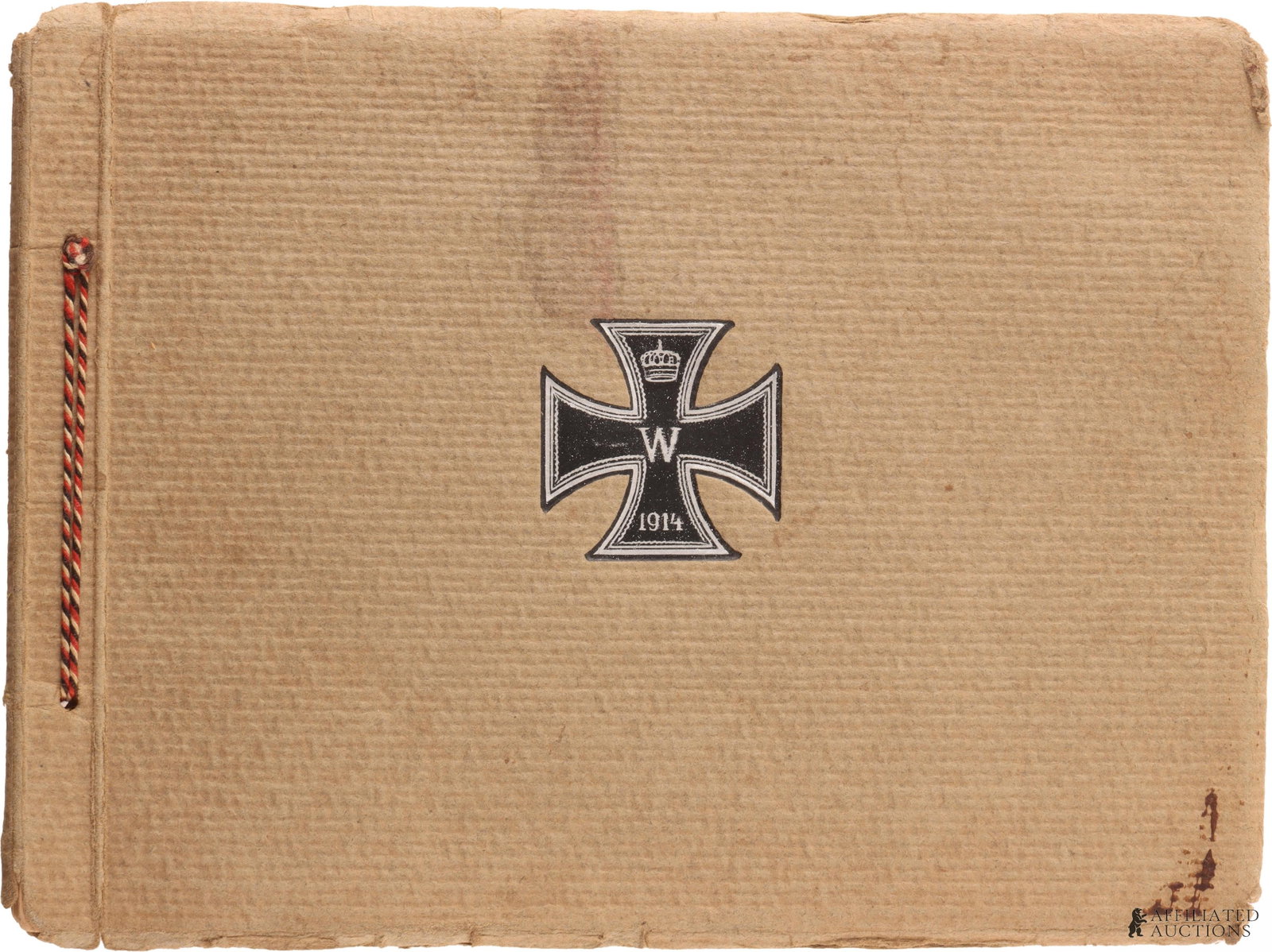 WWI German Photo Album: WWI German Photo Album. The album has a cardboard cover and there is a 1914 Iron Cross painted in the center of the front page. Each Page has a Photograph, a description of the photograph in German,