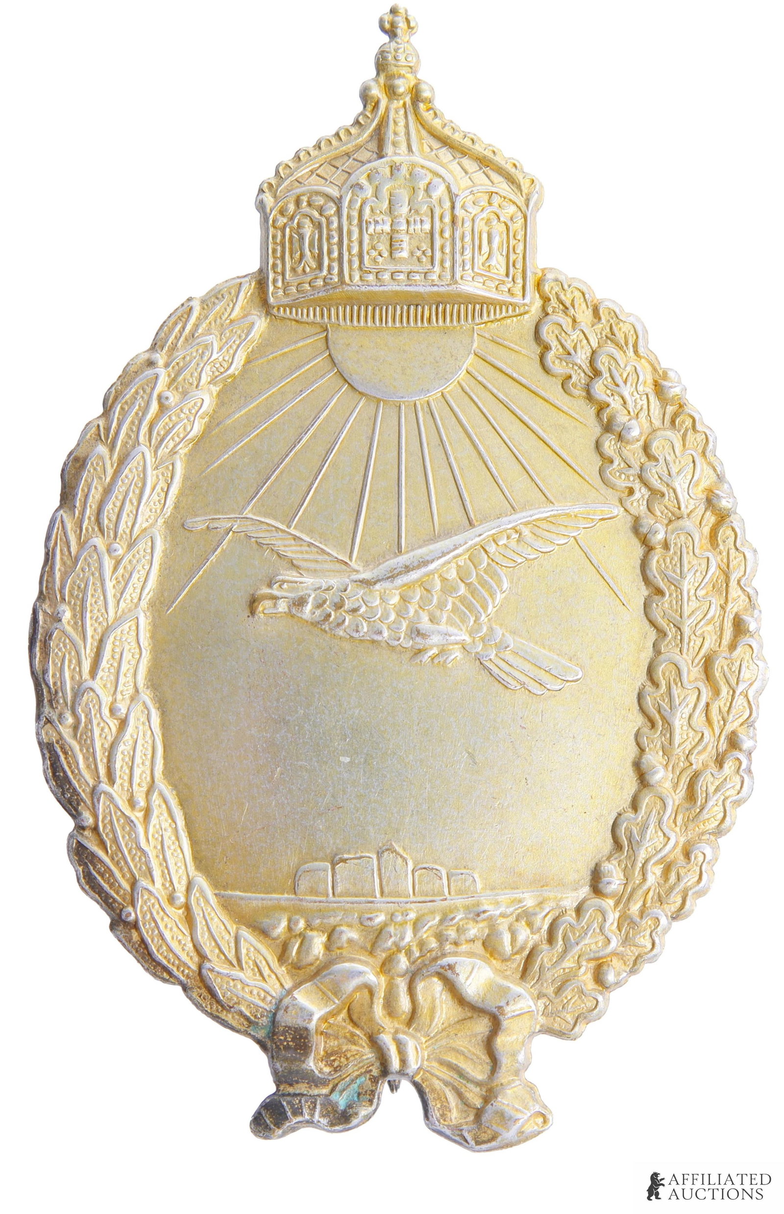 WWI Navy Sea Pilot Badge Imperial German: Navy Sea Pilot badge with imperial crown, laurel and oak leaf wreath, and eagle in flight. It measures 70.39mm. | This lot has a reserve.