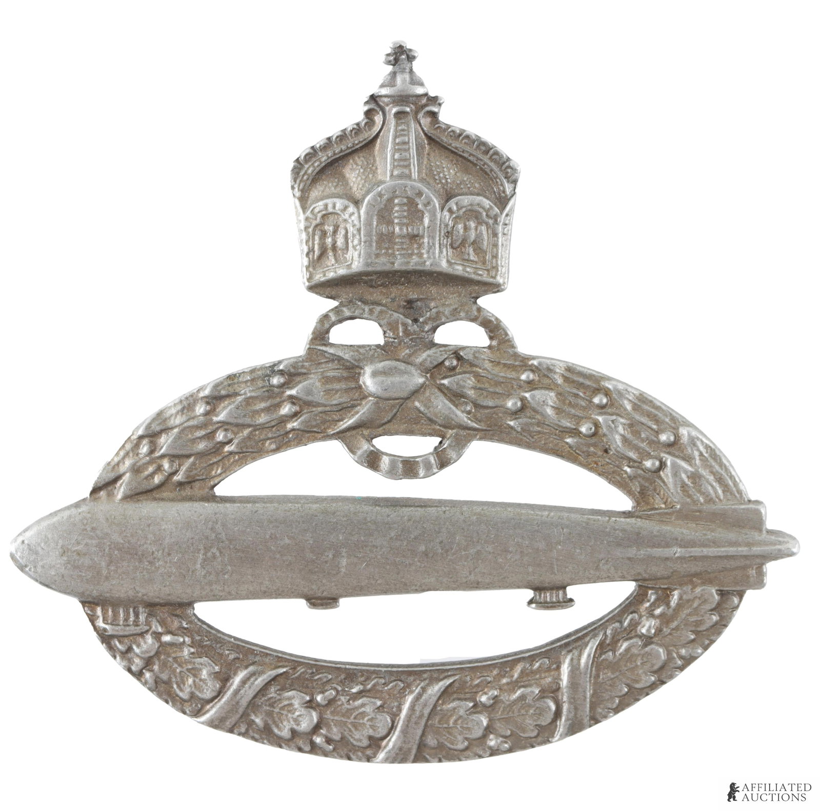 WWI Navy Zeppelin Badge Imperial German: Imperial German Zeppelin badge awarded to members of the German Navy. Silver construction. Measures approximately 2 1/4 inches in width.