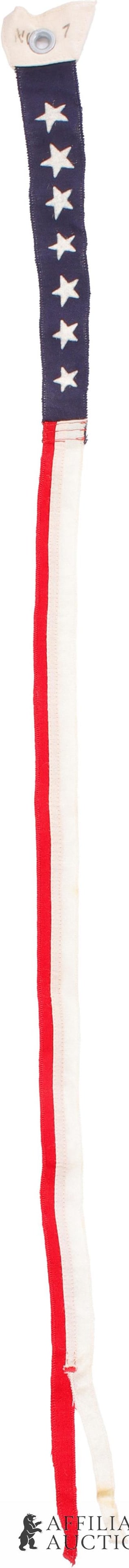 US Commission Flag WWII New Old Stock: A commission pennant, made mostly of wool with seven painted stars. The total length of the piece is 50.5 inches, with a 12.65 inch blue field. Tabs on end, intentionally left to provide excess materi