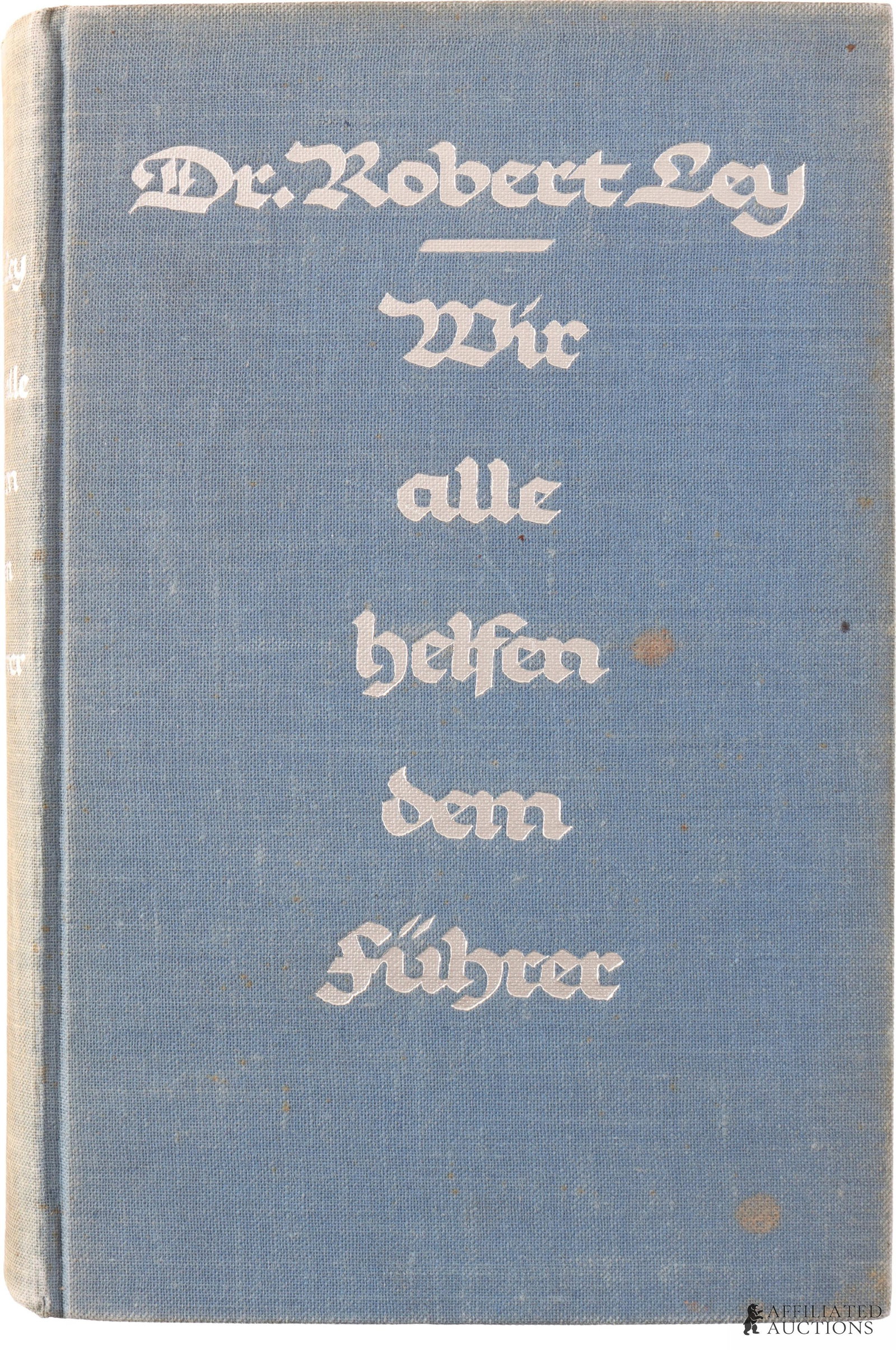 WWII German Third Reich Political Book Ley: A dedicated, signed copy of Wir alle helfen dem F?hrer (English transl. "We are all helping the Leader") by Dr. Robert Ley, with the dedication dated 1936. Dr. Robert Ley was the head of the German La