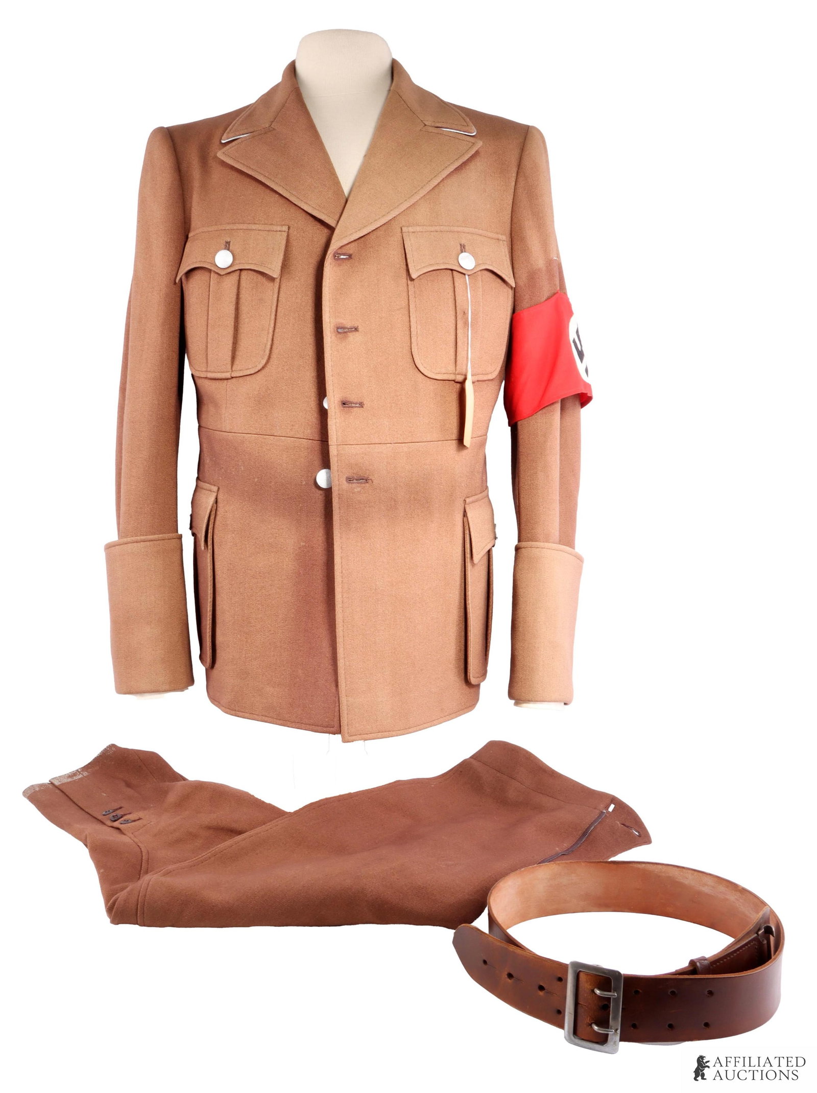 Western Costume Co. Albert Speer Uniform WWII: A three-piece Albert Speer costume produced by the Western Costume Company. Includes tunic of brown wool with silver collar trim and red swastika armband. This lot also includes brown wool trousers,