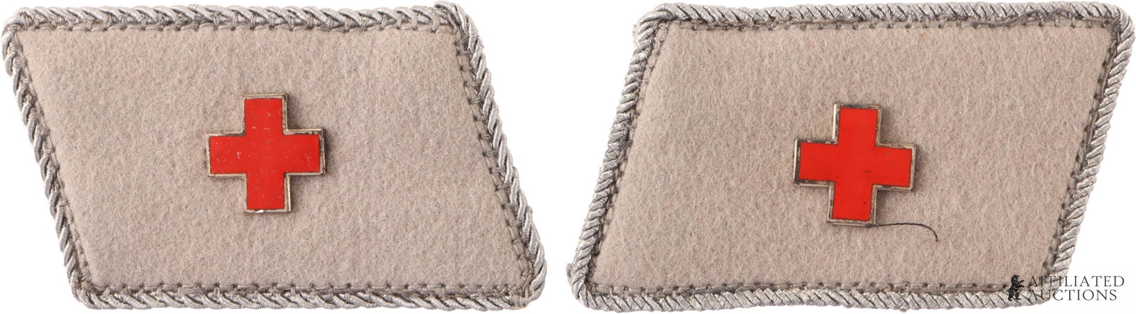 German WWII Red Cross Collar Tabs: German WWII Red Cross Collar Tabs. Silver piping around edges with a red enamel cross in center. Unauthenticated sold as is.