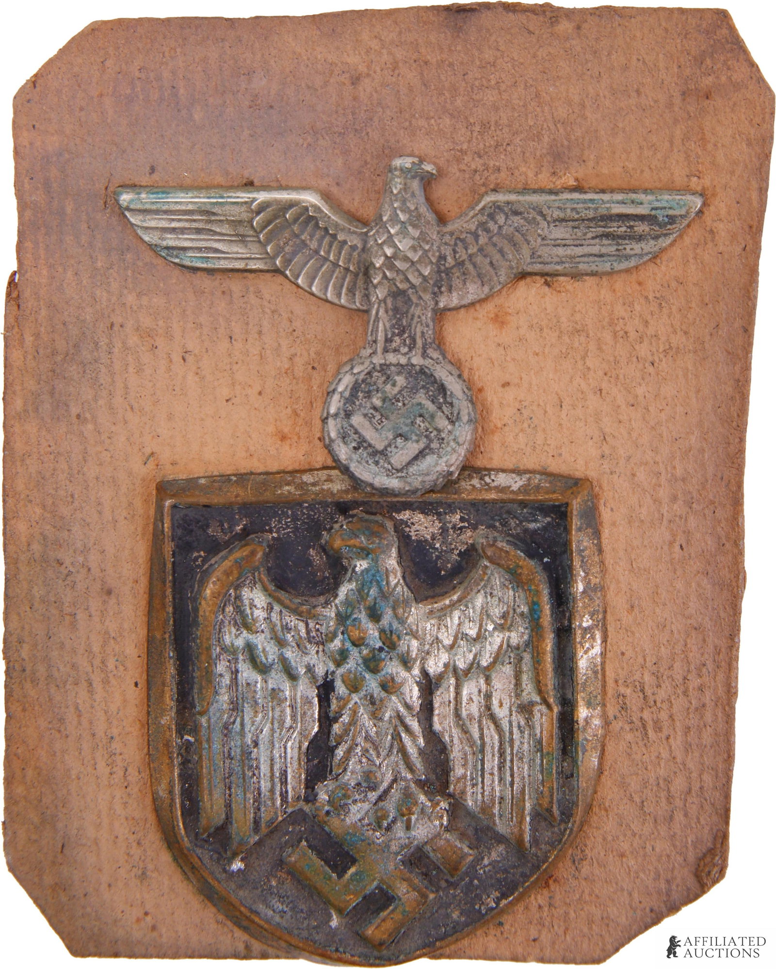 Heer Pith Helmet Shield Insignia & Visor Eagle: Lot of two (2) pieces. Includes Heer shield insignia for pith helmet (Tropenhelm Abzeichen) and Heer visor eagle insignia. Shield is silver-washed, non-magnetic, with three prongs on reverse. Eagle ha