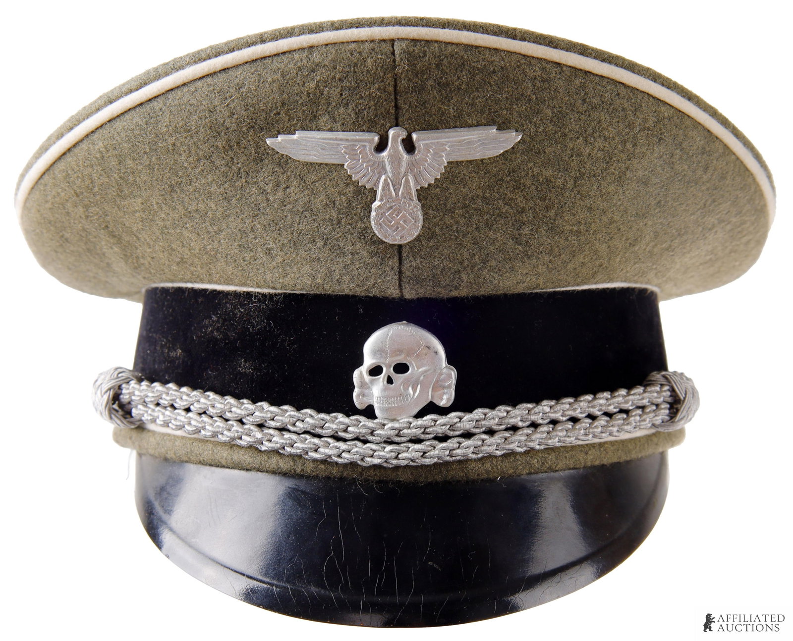 WWII SS Visor German Third Reich Military Cap Hat: A field gray doeskin wool cap. Features white piping, aluminum cap eagle, and black felt hat band with totenkopf emblem. Leather sweatband with gray liner of rayon or silk. Braided aluminum chin cord;