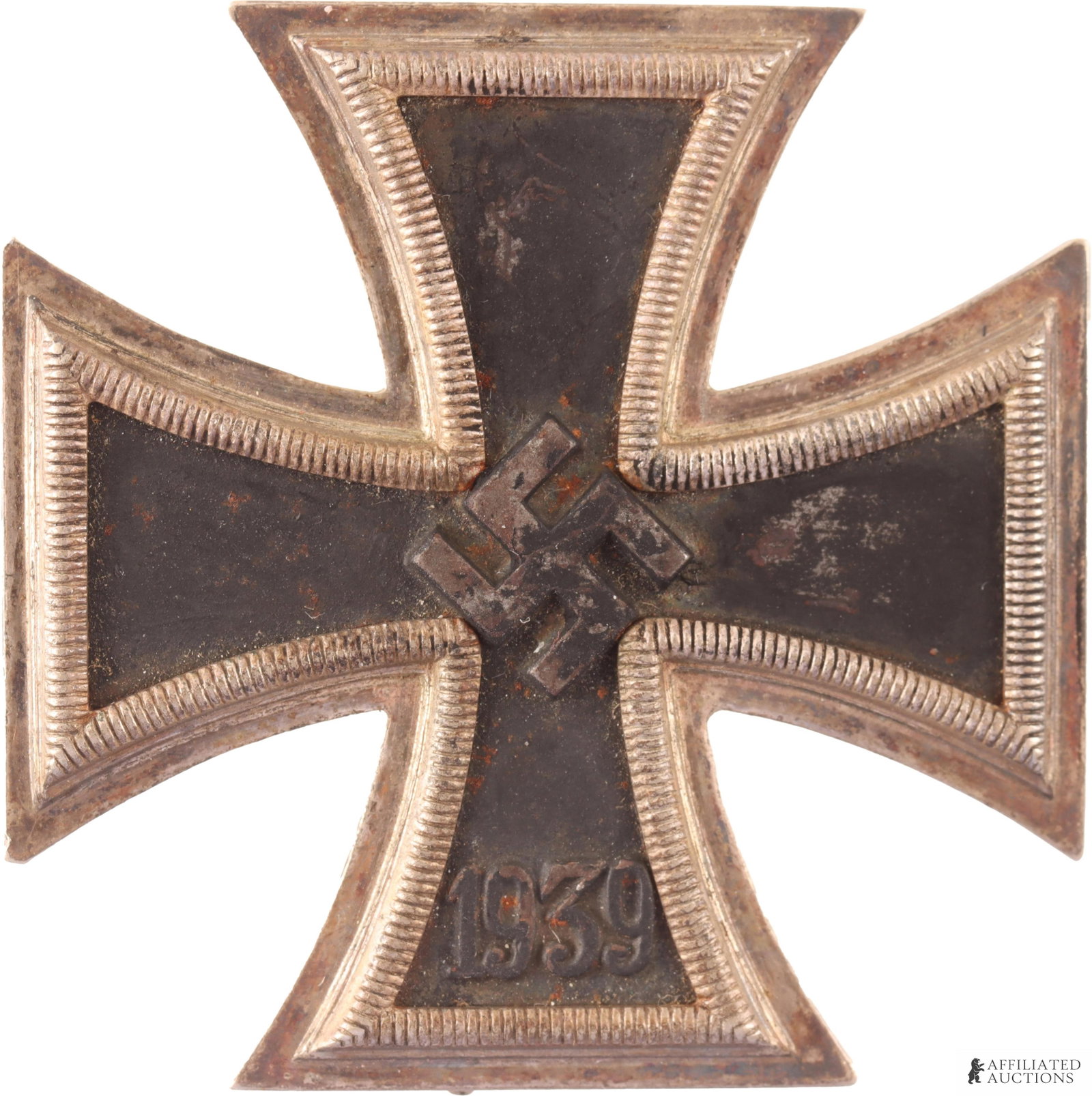 WWII German Iron Cross First Class Third Reich: A WWII German iron cross first class. Black iron core, pin-back; inlay features a relief of a swastika at the center and '1939' below. Marked '65' on pin back (maker's mark for Klein & Quenzer) but la