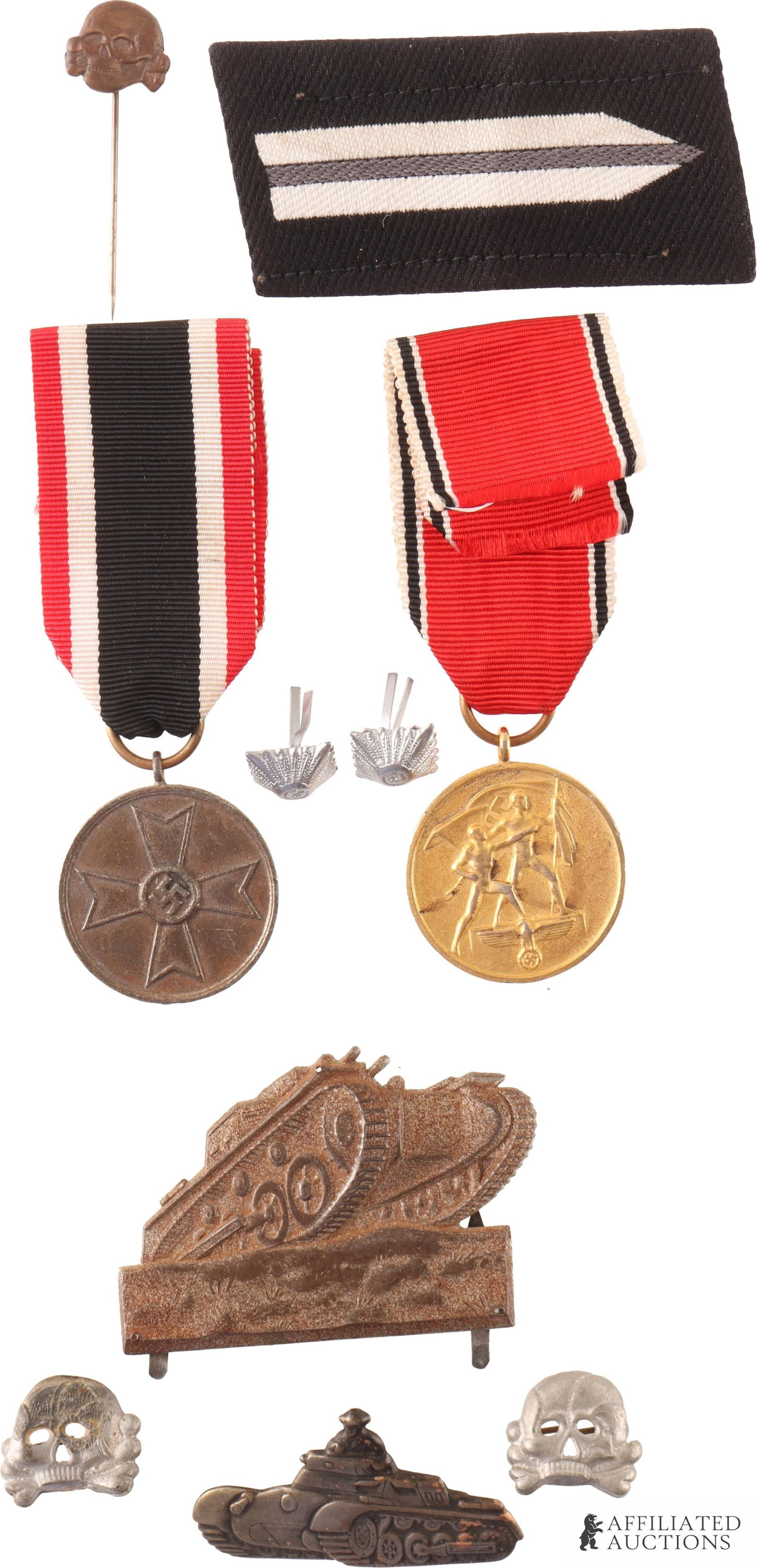 Lot of Ten German Reich Medals, Pins, and Patches: Lot of Ten German Reich Medals, Pins, and Patches. | This lot includes a set of two Panzer Totenkopf insignia, a Totenkopf lapel pin, two shoulder-strap pips, a RAD collar tab, two pins depicting