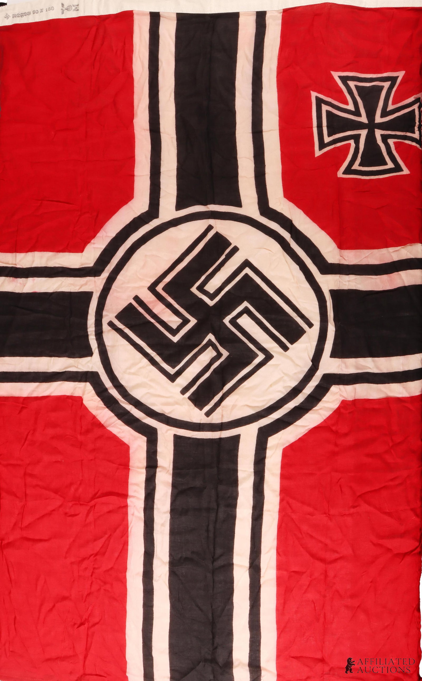 Reichskriegflagge WWII German Third Reich: A Reichskriegflagge of the German Third Reich, bearing a swastika and Iron Cross. Linen. 35.5x59 inches.