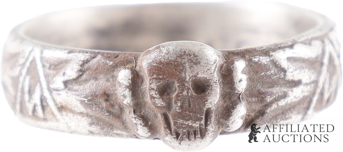 SS-Ehrenring Cased WWII German Third Reich: An SS-Ehrenring bearing the imagery of the Third Reich, with ring of Willigut-designed SS runes and internal Himmler facsimile signature, cased. Silver. Size 10.