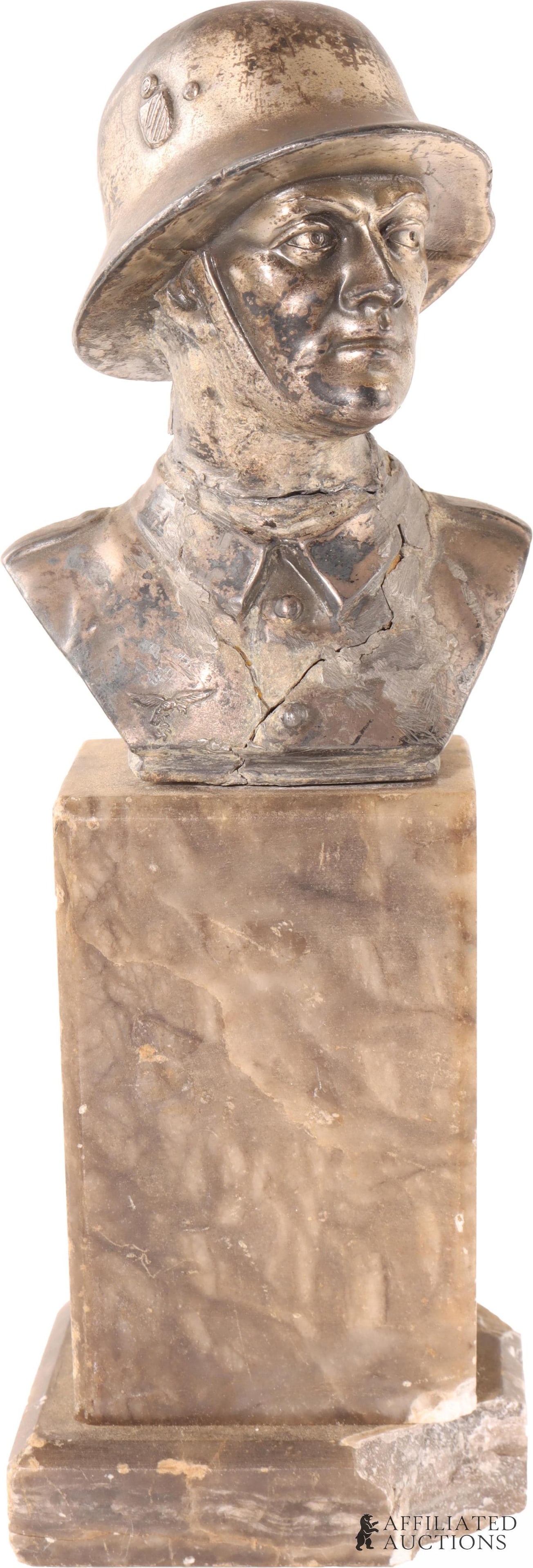 WWII German Third Reich Soldier Statue: A nickel alloy statue of a German soldier, mounted on a marble plinth base. Stands at approximately 9" and measures approx. 3" x 2 1/2" at the base. Shows evidence of previous breakage and repair; hea