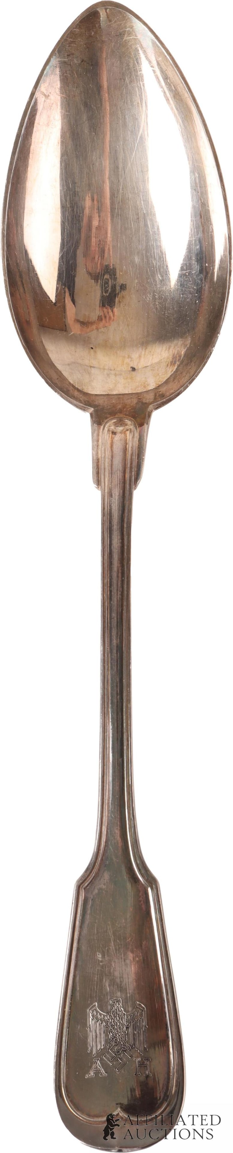 Large Adolf Hitler Serving Spoon WWII German Reich: Silver plated spoon. Monogrammed with AH and eagle. Maker marked on reverse. It measures 10 1/8 inches. | This lot has a reserve.