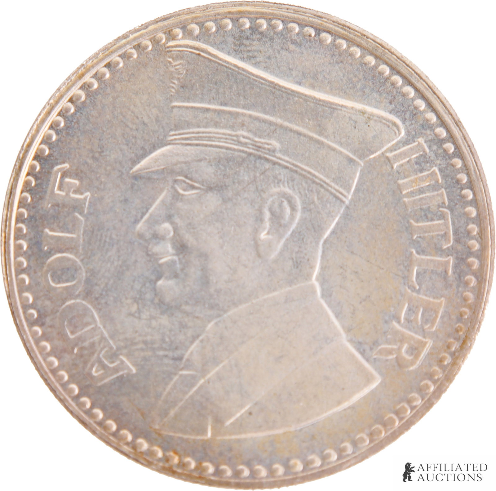 Adolf Hitler Commemorative Coin.: Adolf Hitler Commemerative Coin. The coin depicts a side profile of Adolf Hitler. The text on the front of the coin reads "Adolf Hitler." The reverse side depicts an eagle. The text on the reverse