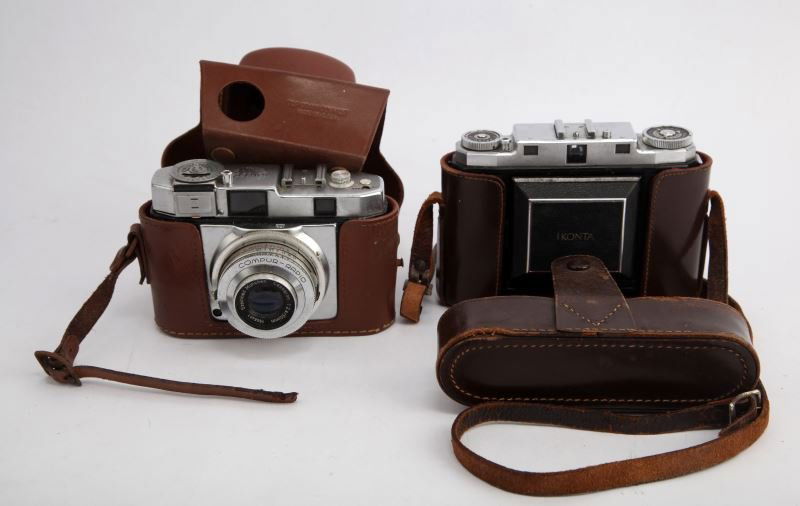 TOWER 51 & ZEISS VINTAGE CAMERA LOT OF TWO: Tower 51 with 50 mm lens, also Zeiss with Tessar 75mm lens, each with leather case in good condition.