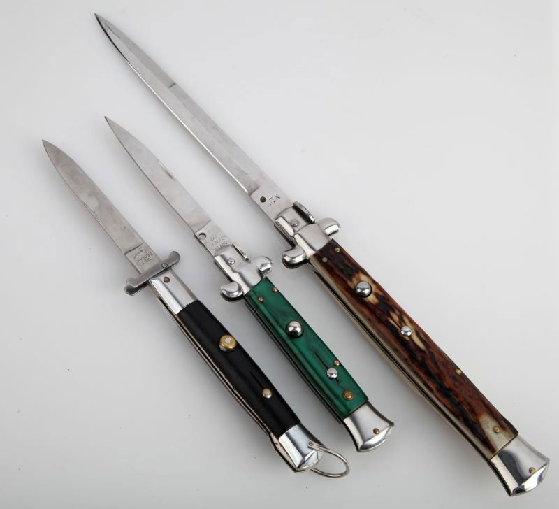 THREE STILETTO AUTOMATIC KNIVES: Three stiletto blade automatic knives, two with 3.75 inch blades, one with 6 inch blade. Good condition.