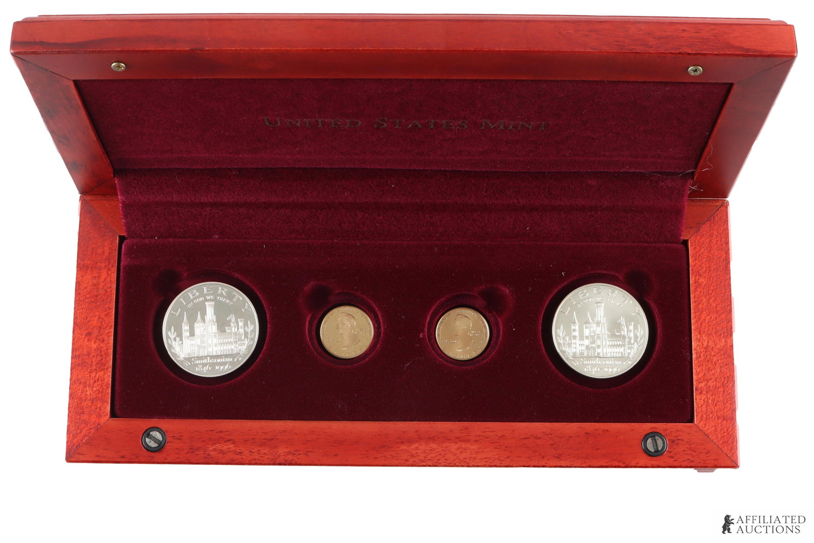 Smithsonian 150th Anniversary Gold & Silver Set: Smithsonian Institution 150th Anniversary. Commemorative 4-coin set. Includes two $5 gold coins (one Proof, one Uncirculated) and two $1 silver coins (one Proof, one Uncirculated). Coins are housed in