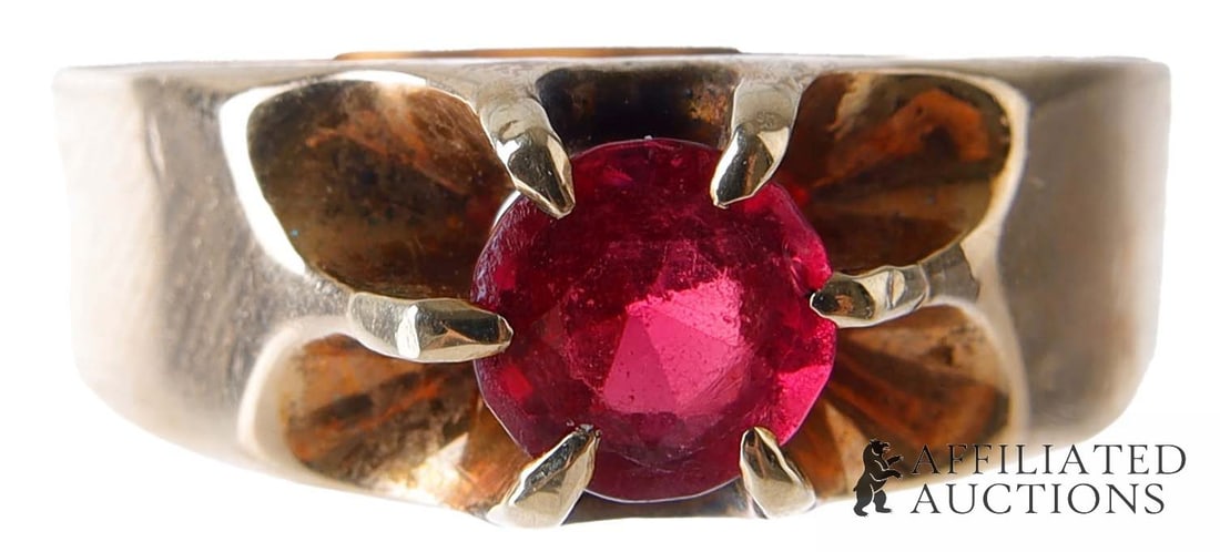 Ruby and 10K Gold Ring Hammerman Brothers: A 10K gold ring with a ruby in a belcher mount. The ring is stamped internally with 'HB' for Hammerman Brothers. Ruby is likely paste. Size 9.5. Weighs 3.2 grams. | This lot has a reserve.